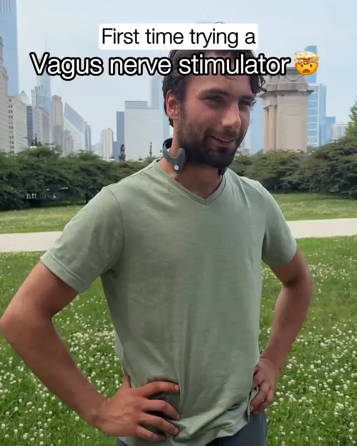 Frame from an official Pulsetto clip showing the Fit device worn on the neck